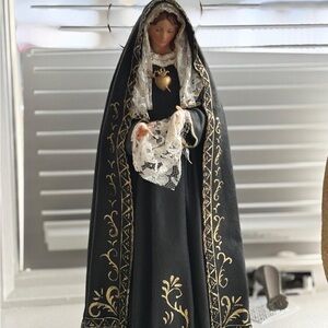 Elegant Black and Gold Religious Figurine